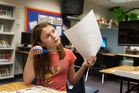 &lt;p&gt;Hayden Meadows Elementary fifth-grader Sophie Pennings, shows her teacher an elephant that she drew and that she made into a collage, Monday at the ASTEP program in Hayden.&lt;/p&gt;