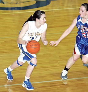 &lt;p&gt;Freshman Shyla Stevenson drives on C-Falls' Madison Sandefer in
the first quarter vs. Wildkats&lt;/p&gt;