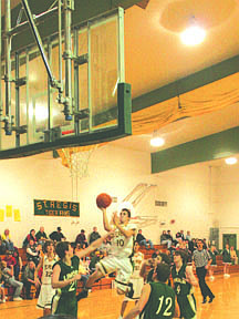 Senior Thomas Spencer breaks through the Lincoln defense to take the ball to the basket.