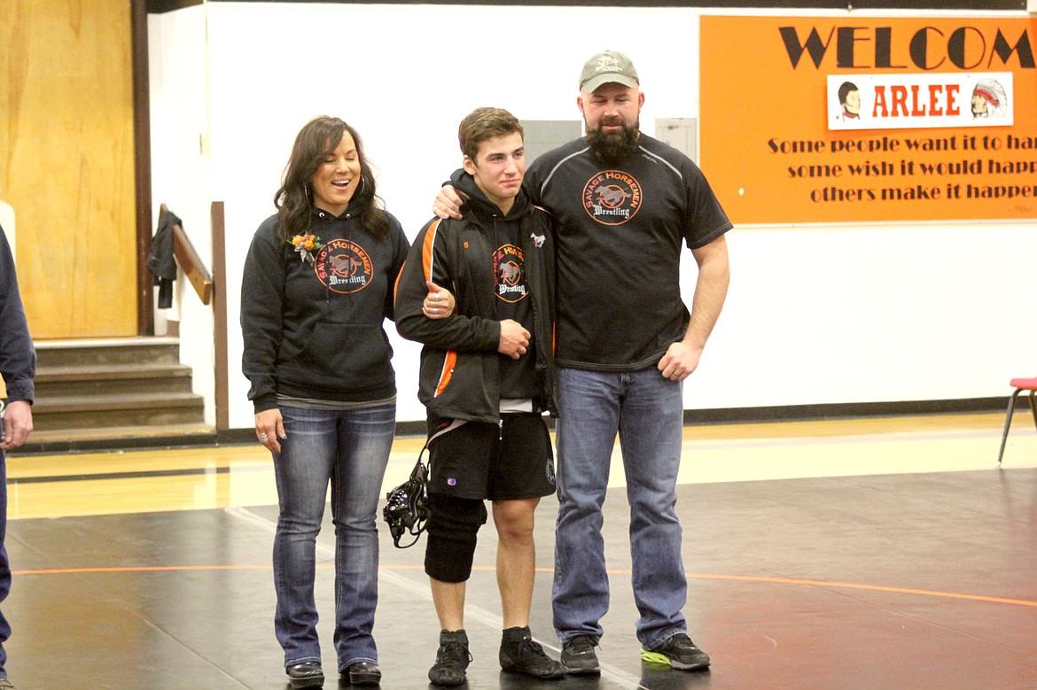 &lt;p&gt;&lt;strong&gt;Jake Lile and his parents, Jerrod and Ruthie Lile, were all smiles as he was honored during senior day for the Savage Horsemen wrestling team.&lt;/strong&gt;&lt;/p&gt;