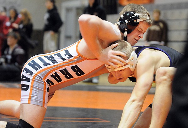 &lt;p&gt;Flathead&#146;s Suny Cheff (left) puts a move on Missoula Sentinel&#146;s
Joey Hiett in a 145-pound semifinal match at the Western AA Seeding
Tournament Saturday morning at Flathead High School. Hiett won by
decision, 3-2. Cheff finished third.&lt;/p&gt;