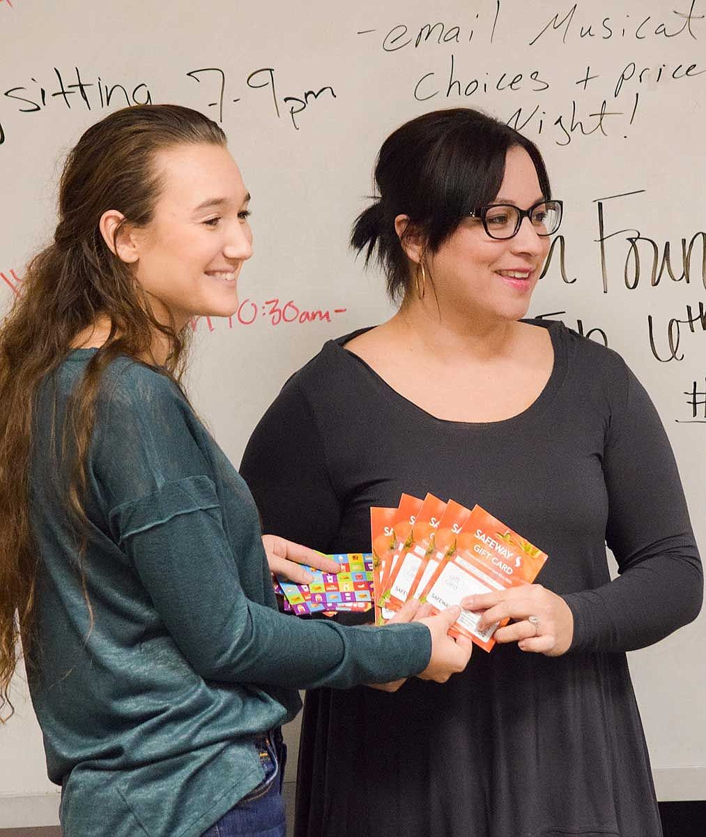 Moses Lake High School Key Clubs Ariana Regimbal presented New Hope shelter advocate Nicole Cedillo with the clubs gift card donations at their meeting Monday night.