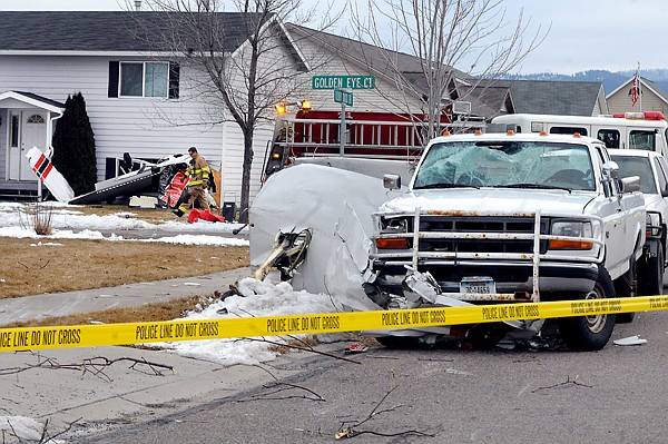 &lt;p&gt;A KALISPELL FIREFIGHTER moves through the debris field at the
scene of a plane crash on Golden Eye Court in Kalispell. One of the
plane&#146;s wings was sheared off and came to rest against this pickup
truck.&lt;/p&gt;