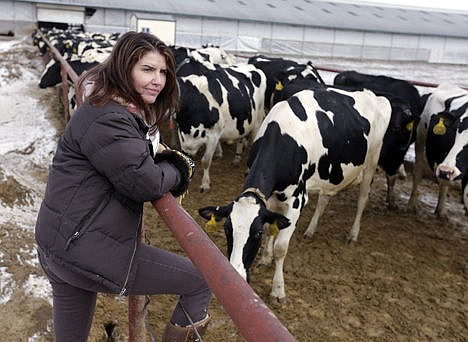 &lt;p&gt;In this Jan. 26 photo, Sue McCloskey, of Fair Oaks Farms, watches as cows move to the milking parlor at the farm, in Fair Oaks, Ind.&lt;/p&gt;