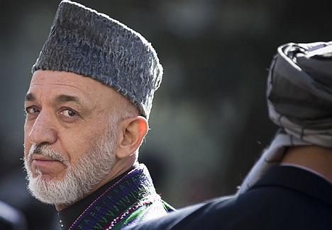 &lt;p&gt;Afghan President Hamid Karzai turns around after reviewing the guard of honor during the first day of Eid Al Adha celebrations on Oct. 26, 2012, at the presidential palace in Kabul, Afghanistan. As the clock ticks toward 2014 and the final withdrawal of NATO and U.S. troops, peace talks with the Taliban are floundering even as the Taliban are showing some hopeful signs, attending international conferences and issuing a statement from their reclusive one-eyed leader with a surprise offer to share power in Afghanistan.&lt;/p&gt;