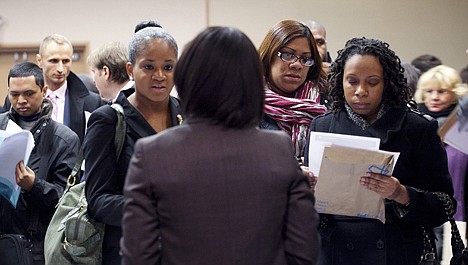 &lt;p&gt;In this Dec. 12, 2011, photo, people talk with a recruiter, center, at a job fair sponsored by National Career Fairs, in New York.&lt;/p&gt;