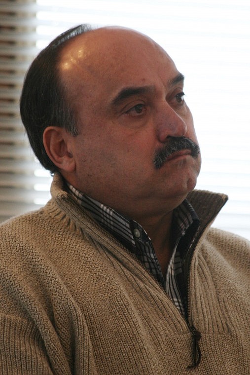 Superior developer Ollie St. Clair sits and listens to testimony during his trial.