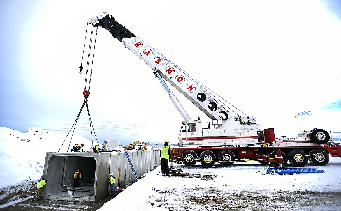 &lt;p&gt;&lt;strong&gt;A crane lowers&lt;/strong&gt; concrete segments of a pedestrian underpass for the U.S. 93 bypass near Glacier High School on Thursday.&#160;&lt;/p&gt;&lt;div&gt;&lt;strong&gt;&#160;&lt;/strong&gt;&lt;/div&gt;