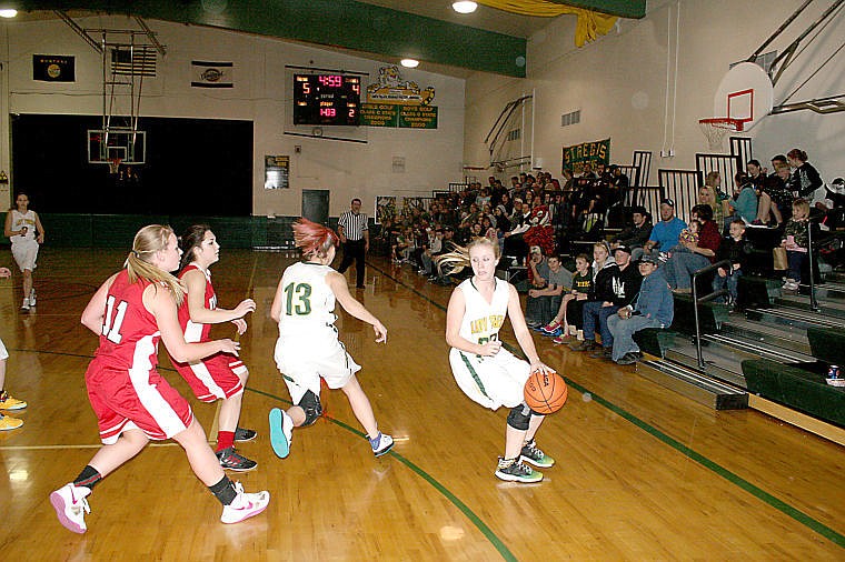 &lt;p&gt;Pilar Cantrell-Field dribbles the ball as she looks over her shoulder to check on the Noxon players pursuing her.&lt;/p&gt;