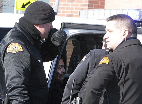 &lt;p&gt;Michael Tavares, 33, Post Falls, inside vehicle, led law enforcement agencies on a chase from Coeur d'Alene to Airway Heights, Wash., on Tuesday. Washington State Patrol Trooper Greg Birkeland, left, WSP Sgt. Kris Schweigert question Tavares at the Airway Heights Walmart where the chase ended.&lt;/p&gt;