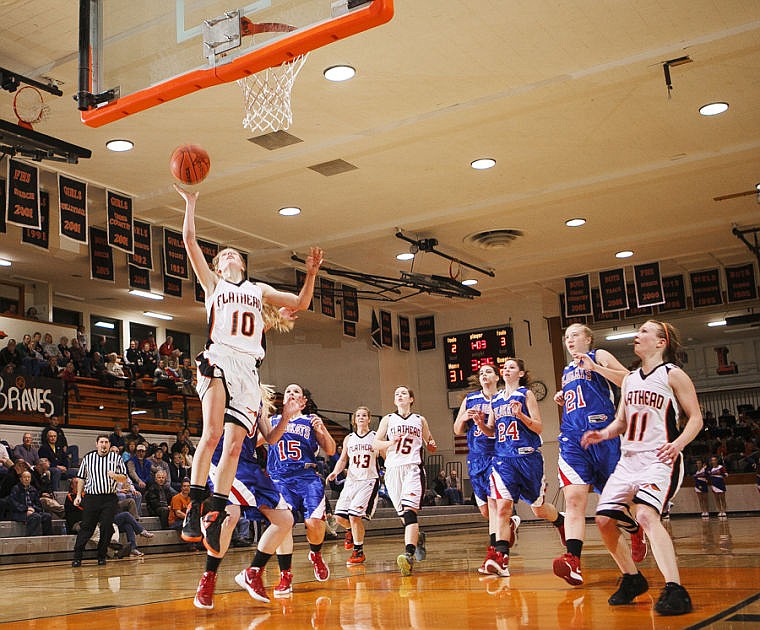 &lt;p&gt;Flathead&#146;s Emma Andrews goes in for a layup to finish off a fast break Tuesday night during the Bravettes&#146; win over Columbia Falls at Flathead High School.&lt;/p&gt;