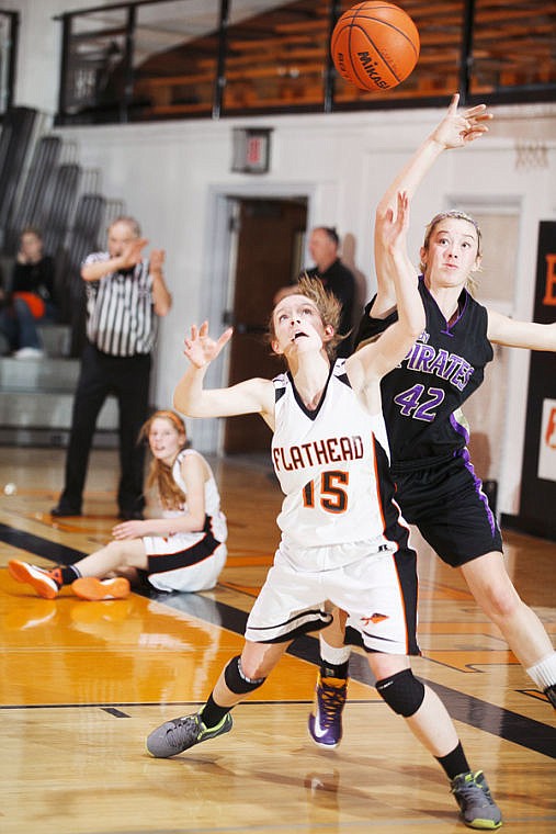 &lt;p&gt;Flathead's Emily Russell (15) battles Polson's Monika Frame (42) for a loose ball Thursday night during the Bravettes' home victory over Polson. Thursday, Jan. 17, 2013 in Kalispell, Montana. (Patrick Cote/Daily Inter Lake)&lt;/p&gt;