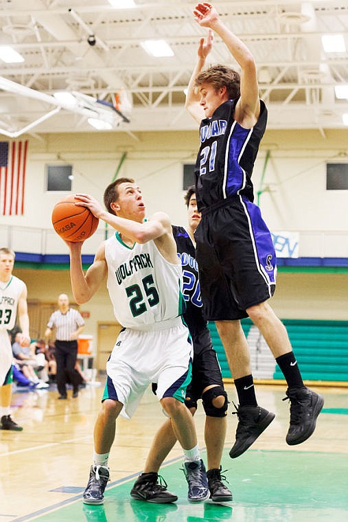 &lt;p&gt;Stillwater Christian's BJ Bach (21) jumps to block the shot of Glacier's Cain Boschee (25) Tuesday night during Glacier JV's victory over Stillwater Christian at Glacier High School. (Patrick Cote/Daily Inter Lake)&lt;/p&gt;