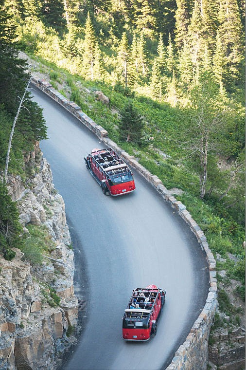 &lt;p&gt;Red buses drive up Going-to-the-Sun Road in August 2012 as viewed from the Highline Trail in Glacier National Park. The prospectus for Glacier&#146;s main concessions contract requires restoration of at least 15 of the park&#146;s 33 distinctive buses.&lt;/p&gt;