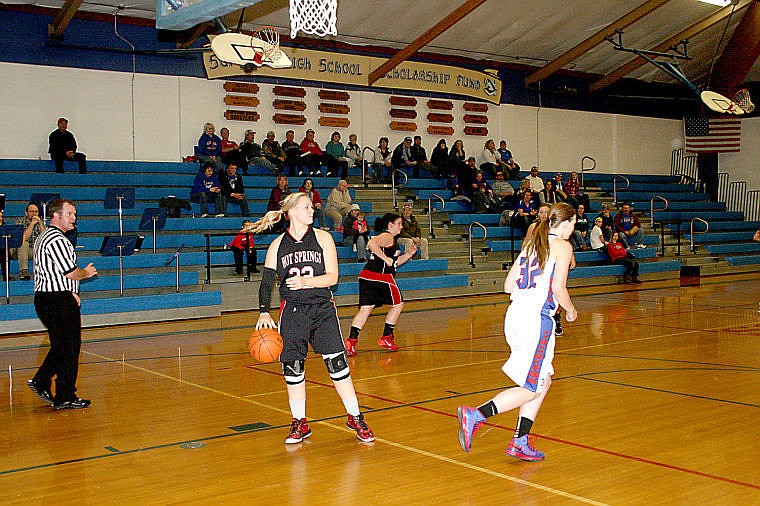 <p>Lady Savage Heat Alex Green dribbles the ball while she looks for an open teammate in the game against Superior.</p>
