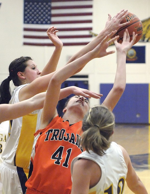 &lt;p&gt;Post Falls' Dani Failor's first quarter shot attempt is doomed to fail with a hand in her face and by being swatted by Lewiston's Savannah Blinn.&lt;/p&gt;
