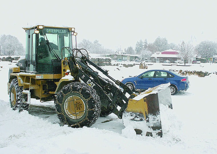 &lt;p&gt;Batt Lulack busies himself with plowing the properties on Lynch Street in Plains on Monday. Lulack cleared a number of parking lots for local businesses.&lt;/p&gt;