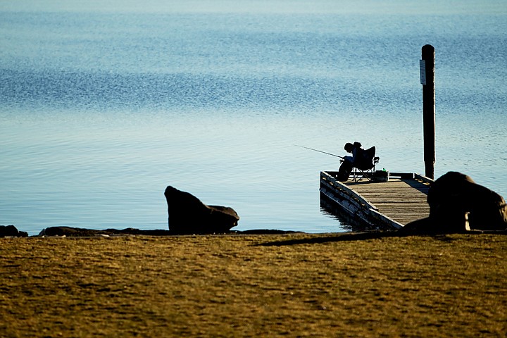 &lt;p&gt;JEROME A. POLLOS/Press Dalton Jackson scans the surface of Lake Coeur d'Alene near the North Idaho College beach as he fishes off the dock Tuesday from the comfort of his folding chair.&lt;/p&gt;