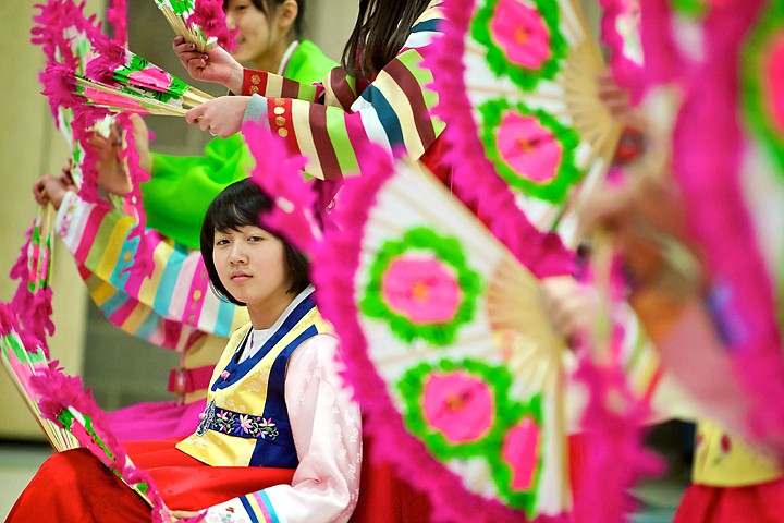 &lt;p&gt;JEROME A. POLLOS/Press Kim Suyeon watches as her friends and classmates perform a Korean fan dance during the Korean-American culture night Monday at Woodland Middle School in Coeur d'Alene. The exchange students from Geoje Middle School in&lt;/p&gt;