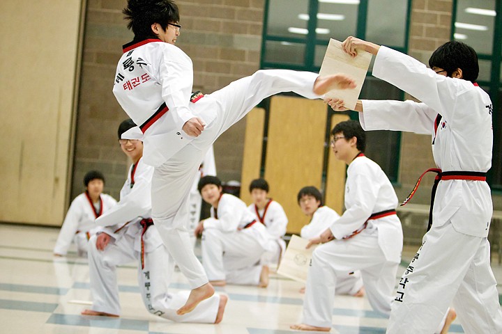 &lt;p&gt;JEROME A. POLLOS/Press Lee Jooyong spins through the air as he goes up to break a board with a kick during a taekwondo demonstration at the Korean-American Culture Night.&lt;/p&gt;