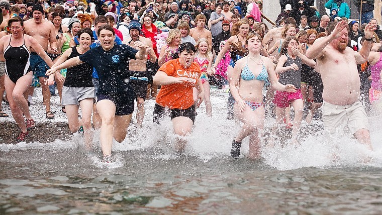 &lt;p&gt;Participants make their way into the 39-degree waters of Flathead Lake Tuesday afternoon during the annual Polar Bear Plunge at The Raven in Woods Bay. (Patrick Cote/Daily Inter Lake)&lt;/p&gt;