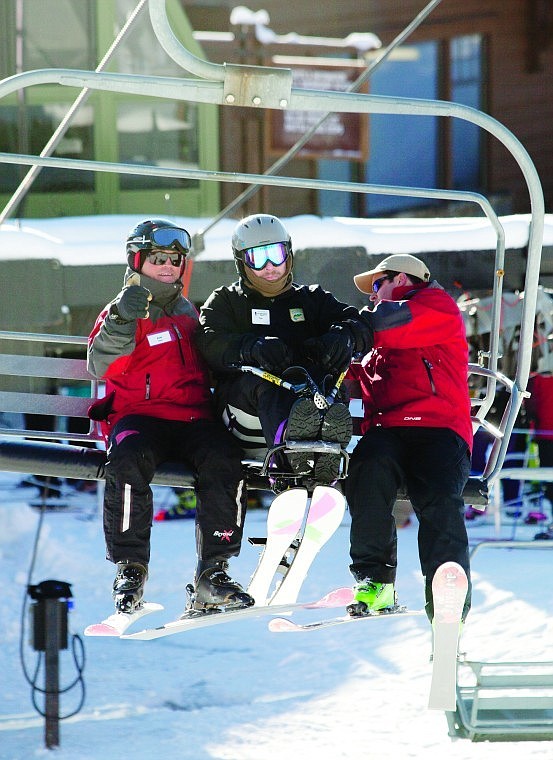 &lt;p&gt;Whitefish Mountain Resort ski instructors Mike Craft, right, and
Andy Pollard, left, help secure Staff Sgt. Tom Rollason on the base
lodge chair lift at Whitefish Mountain Resort Friday morning.
Rollason served in both the Navy and Army and was injured by an IED
in September 2009.&lt;/p&gt;