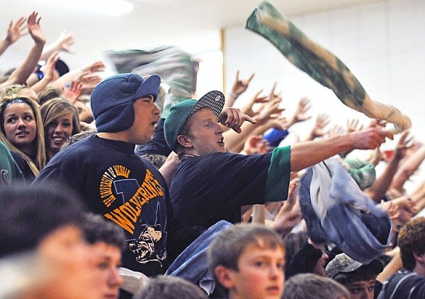 The Glacier student section tries to distract a Flathead player shooting free throws.