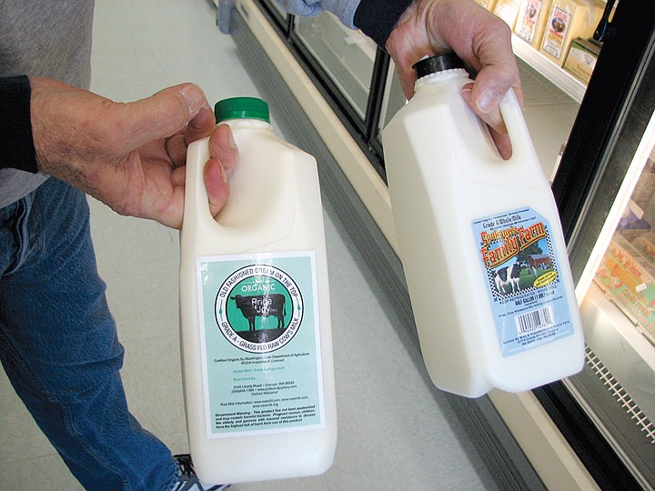 Womack holds the brands of organic milk sold at his Moses Lake.