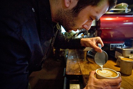 &lt;p&gt;Bryan Arndt prepares a coffee drink with an artistic design using foam Thursday at Java on Sherman.&lt;/p&gt;