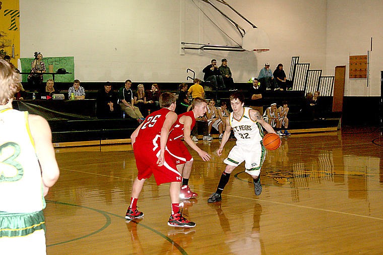 &lt;p&gt;St. Regis Tiger Dakota Wickham prepares to dart around two Noxon players during a home game.&lt;/p&gt;