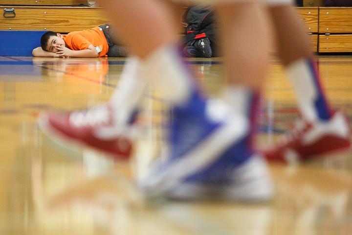 &lt;p&gt;A fan watches players run by Thursday night during Bigfork's non conference victory over Columbia Falls.. Thursday, Jan. 31, 2013 in Columbia Falls, Montana. (Patrick Cote/Daily Inter Lake)&lt;/p&gt;