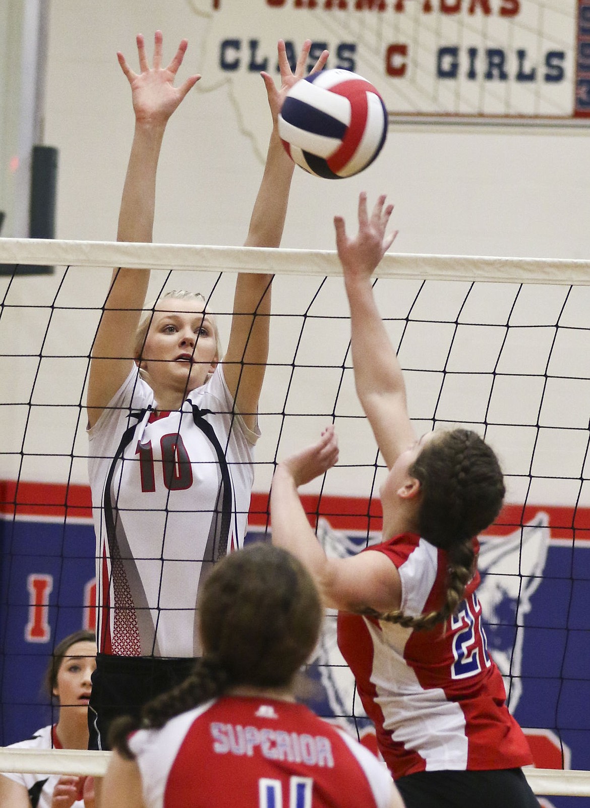 &lt;p&gt;Carly Hergett looks to block a tip by a Superior player on Friday afternoon at the district volleyball tournament.&lt;/p&gt;