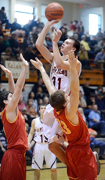 &lt;p&gt;Flathead junior Matt Quist (31) shoots over two Missoula Hellgate defenders during Saturday&#146;s Western AA boys basketball game at Flathead High School. Quist scored six points.&lt;/p&gt;