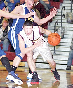 &lt;p&gt;Troy senior guard Cory Orr drives low for the lane past Libby's
Nolan Broden in fourth quarter action Friday night. Broden was
responsible for keeping Orr's 3-point hoops to a minimum.&lt;/p&gt;