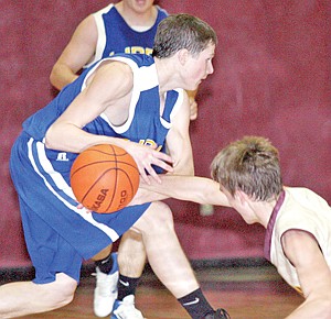 &lt;p&gt;Troy's Ryan Rayson attempts to strip the ball away from Elias
Lapka but Libby manages to retain, third quarter.&lt;/p&gt;