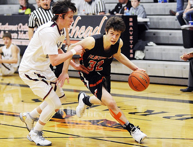 &lt;p&gt;Flathead&#146;s Tyler Johnson drives past Helena High&#146;s AJ Kanthack during the third quarter of Friday&#146;s Western AA boys basketball game at Flathead High School. Johnson, a freshman, finished with 16 points. (Aaric Bryan/Daily Inter Lake)&lt;/p&gt;