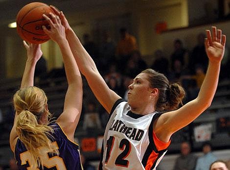 Flathead&#146;s Kendalyn Habel (12) breaks up a pass by Missoula Sentinel&#146;s Michelle Powers in second-quarter action at Flathead on Tuesday night. Garrett Cheen/Daily Inter Lake