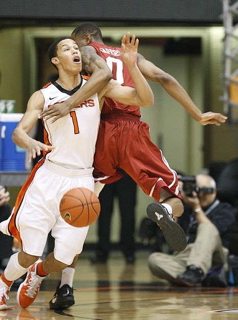 &lt;p&gt;Oregon State's Jared Cunningham (1) is fouled by Washington State's Marcus Capers (0) during the first half Saturday in Corvallis, Ore.&lt;/p&gt;