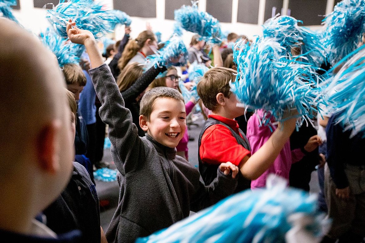 &lt;p&gt;North Idaho STEM Charter Academy fourth-grader Scott Glass waves pom-poms and cheers with his classmates during an assembly Thursday at the Academy in Rathdrum. Academy students are taking part in the Khan Academy LearnStorm Project, a nine-week math challenge course designed to improve student's math skills while they earn rewards.&lt;/p&gt;