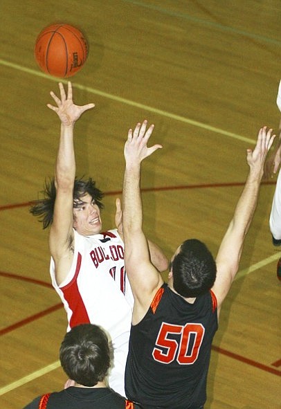 &lt;p&gt;Sandpoint senior Brandon Lawrence shoots a jump hook in the lane over Jeremy Cragin of Post Falls.&lt;/p&gt;