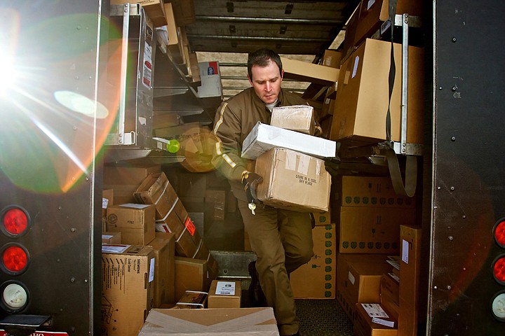 &lt;p&gt;Tony Caldero, a UPS driver in Coeur d'Alene, carries packages from inside his delivery truck Tuesday during his morning route. Caldero, an Army veteran and UPS employee for the past 20 years, has one of the few careers left that don't require a college degree, provide benefits at no cost to the employee and offer a pension after 25 years of employment.&lt;/p&gt;