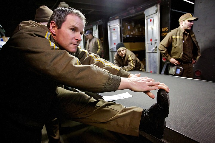 &lt;p&gt;Tony Caldero stretches during a UPS driver meeting before he begins his delivery route Tuesday. With bad knees and backs a common problem with his coworkers, Caldero tries to minimize work-related injuries through stretching and proper lifting techniques.&lt;/p&gt;