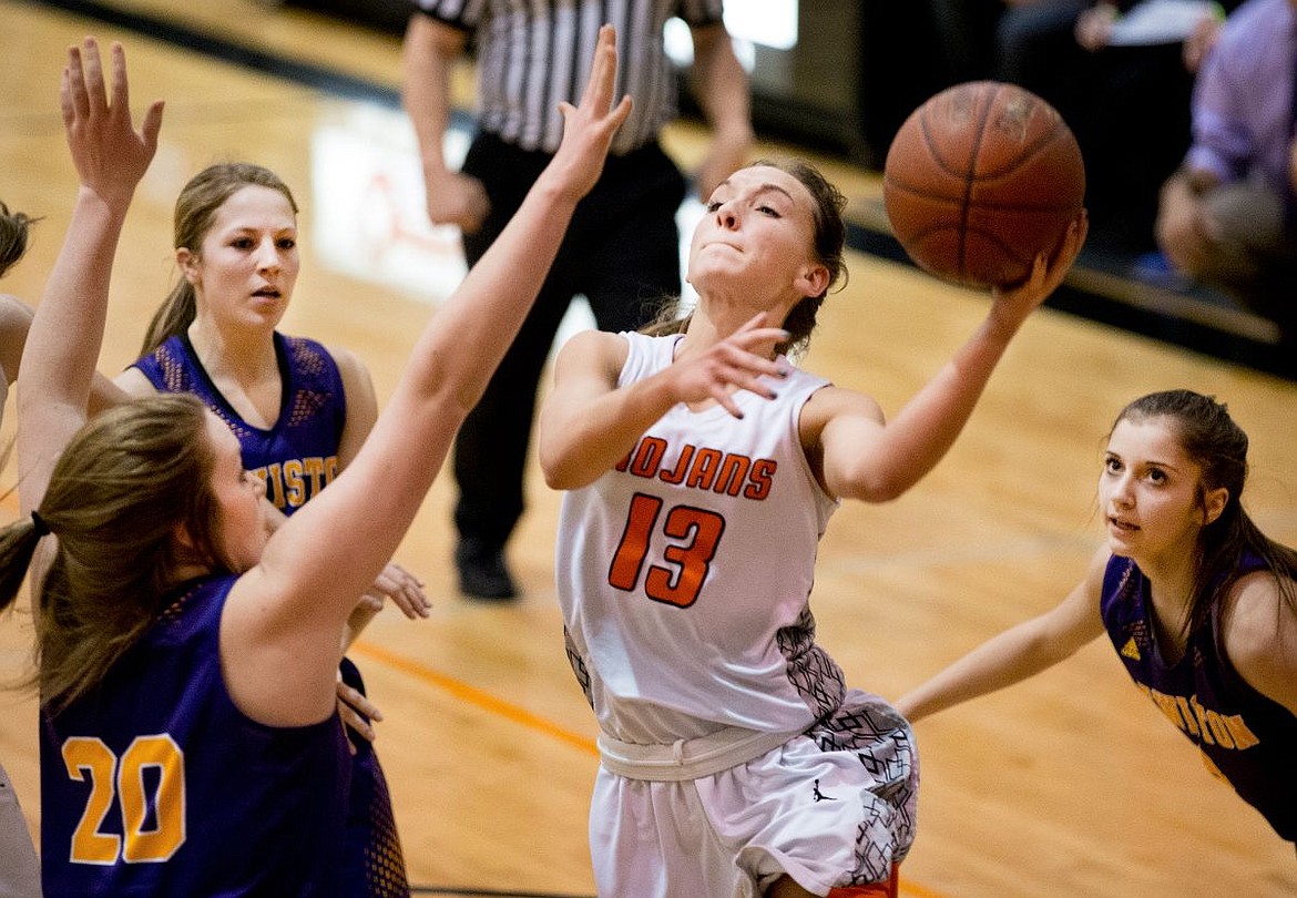 &lt;p&gt;JAKE PARRISH/Press Post Falls' Bayley Brennan looks to the basket as she's defended by Lewiston's Cameron Cady (20) on Friday at Post Falls High School. Brennan scored 12 points for the night.&lt;/p&gt;