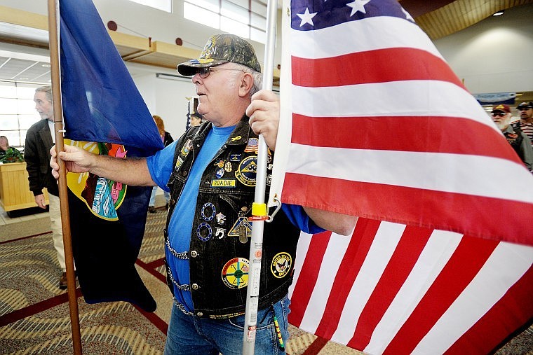 Bob Bell of Ronan and other Patriot Guard members prepare to welcome Wounded Warriors on Wednesday.