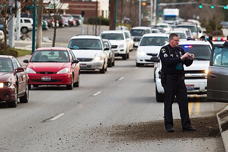 &lt;p&gt;A trooper with the Idaho State Police takes photographs of the vehicle that was involved in a high speed pursuit as northbound traffic is backed up on Northwest Boulevard.&lt;/p&gt;