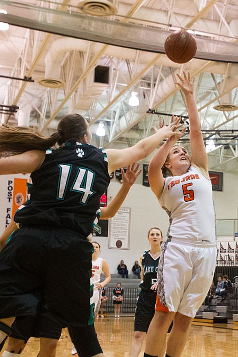 &lt;p&gt;Post Falls High School's Olivia Ellison (5), makes a jump shot against the defense of Lauren Rewers (14) of Lake City in the first round of the 5A Region 1 girls basketball tournament at The Arena.&lt;/p&gt;