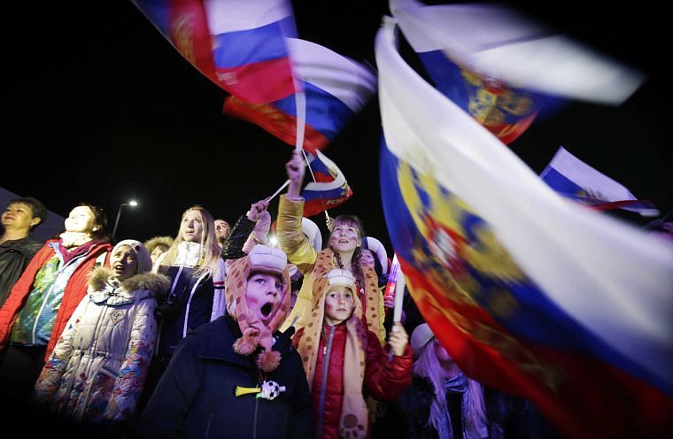 &lt;p&gt;A Russian child yawns while others wave the national flag as the Russian national anthem is played during the 2014 Winter Olympics opening ceremony on Friday, Feb. 7, 2014, in downtown Sochi, Russia. (AP Photo/Wong Maye-E)&lt;/p&gt;