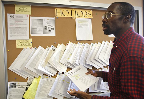 &lt;p&gt;In this photo taken on Thursday, job seeker Richard Phillips looks for a video post-production job opportunity at the Verdugo Job Center in Glendale, Calif. Finding a job remains a struggle 20 months after the recession technically ended.&lt;/p&gt;