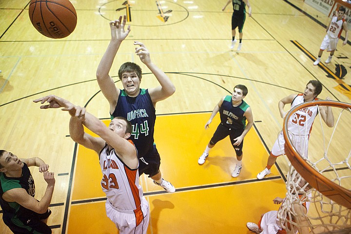 &lt;p&gt;Flathead's Austin Jones (33) and Glacier's Ryan Edwards (44) go
after a rebound during Thursday night&#146;s crosstown basketball game
at Flathead High School.&lt;/p&gt;