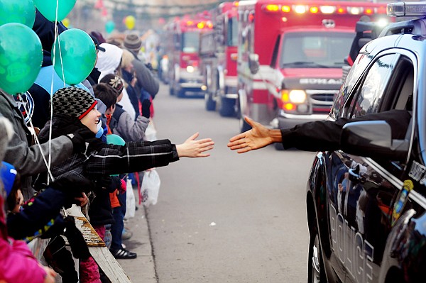 &lt;p&gt;Mitchell Johnson, 8, of Creston, reaches out to get a high five
from Whitefish Police Department Chaplain Don Dukes on Saturday
afternoon during the Winter Carnival Parade.&lt;/p&gt;